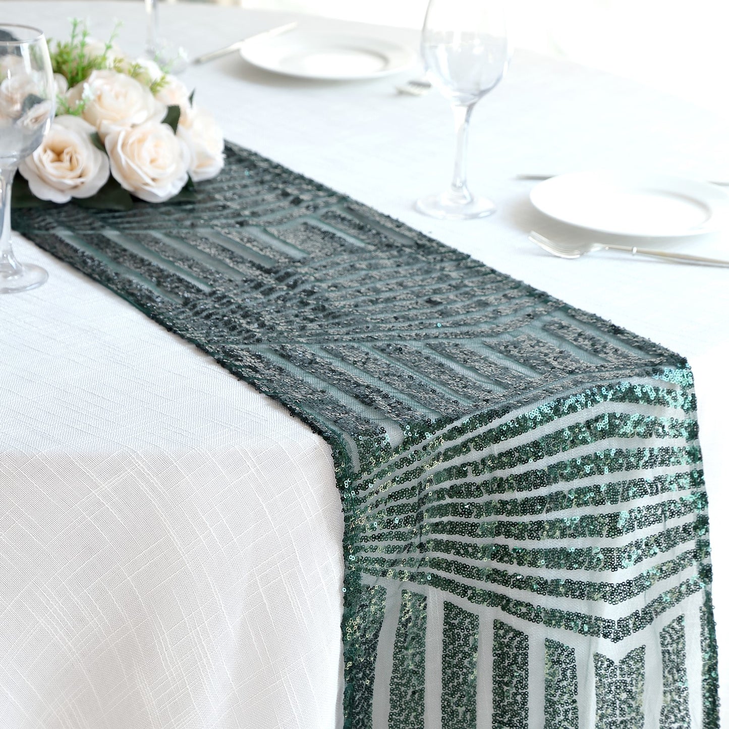 Hunter emerald green diamond glitz sequin table runner on a dining table.