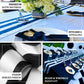Black and white stripe satin table runner on a decorated dining table.