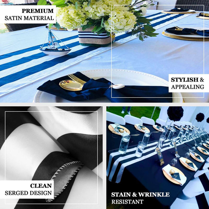 Black and white stripe satin table runner on a decorated dining table.