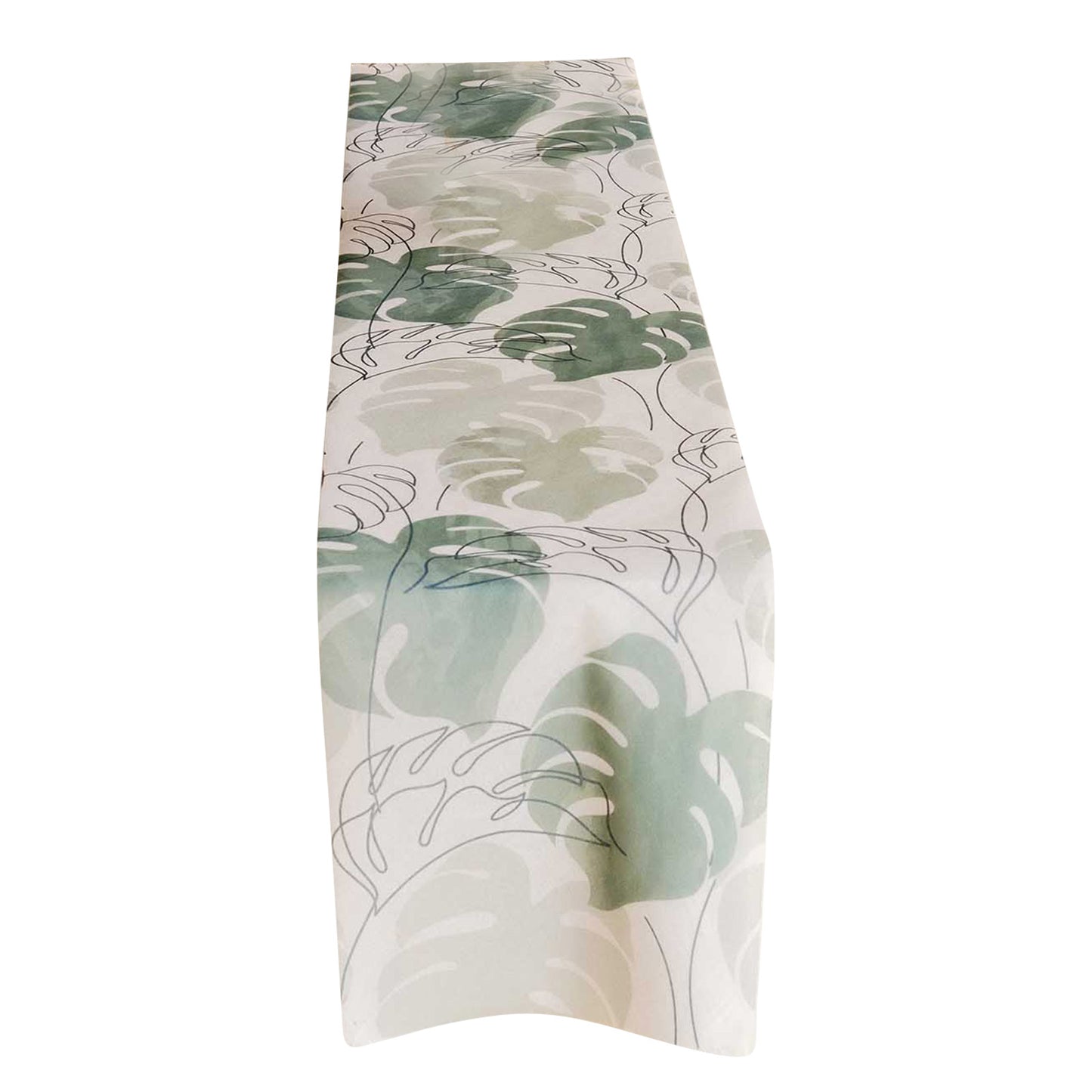 White table runner with green monstera palm leaves print.