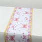 White table runner with pink butterflies for spring summer dining decor.