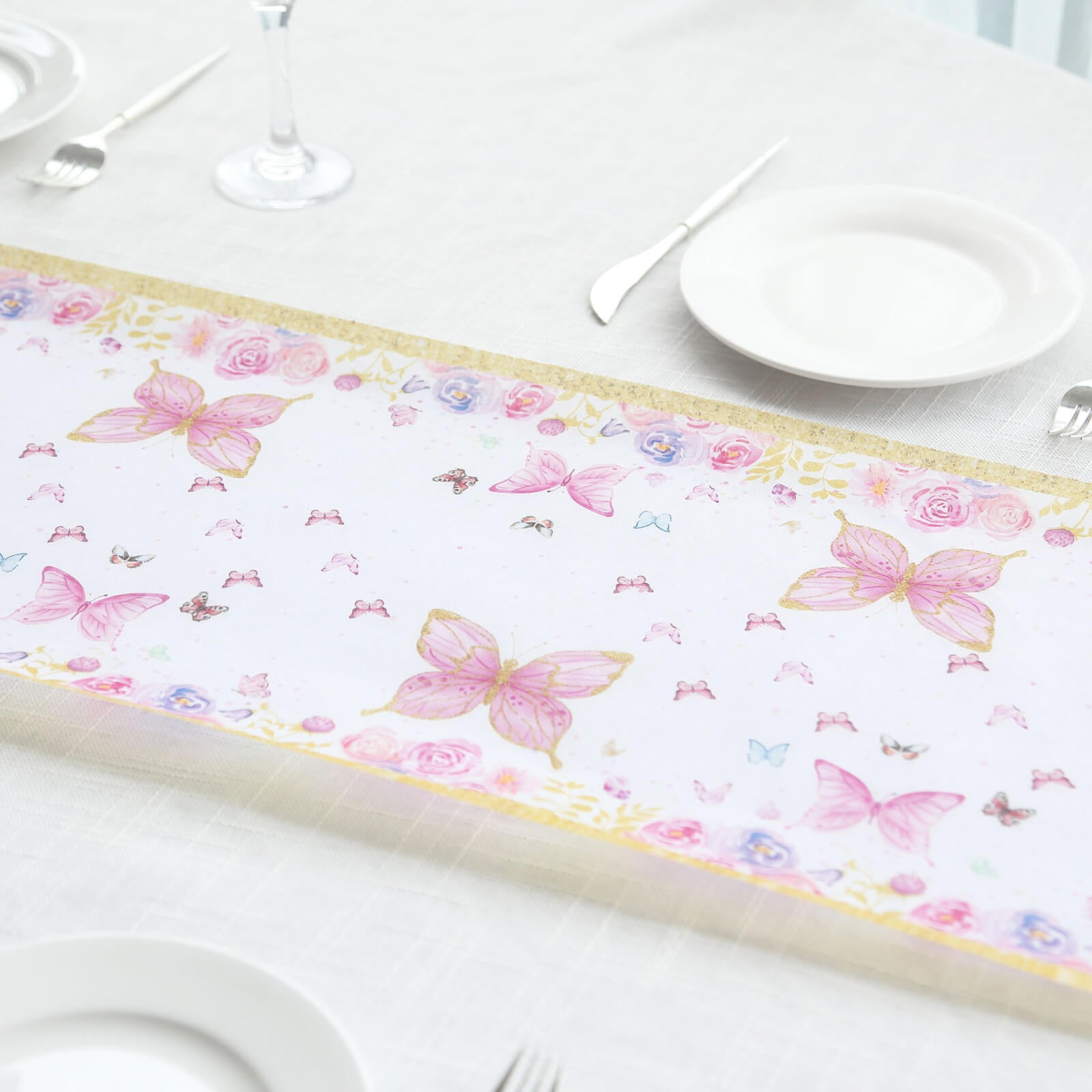 White table runner with pink butterflies, perfect for spring and summer dining decor.