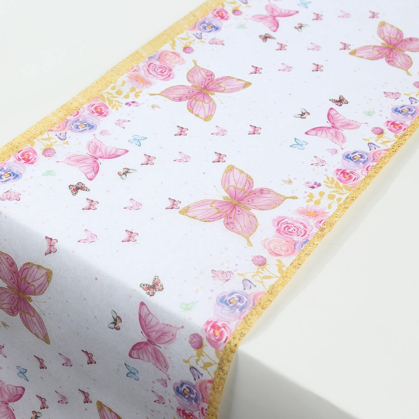 White table runner with pink butterflies for spring summer dining decor.