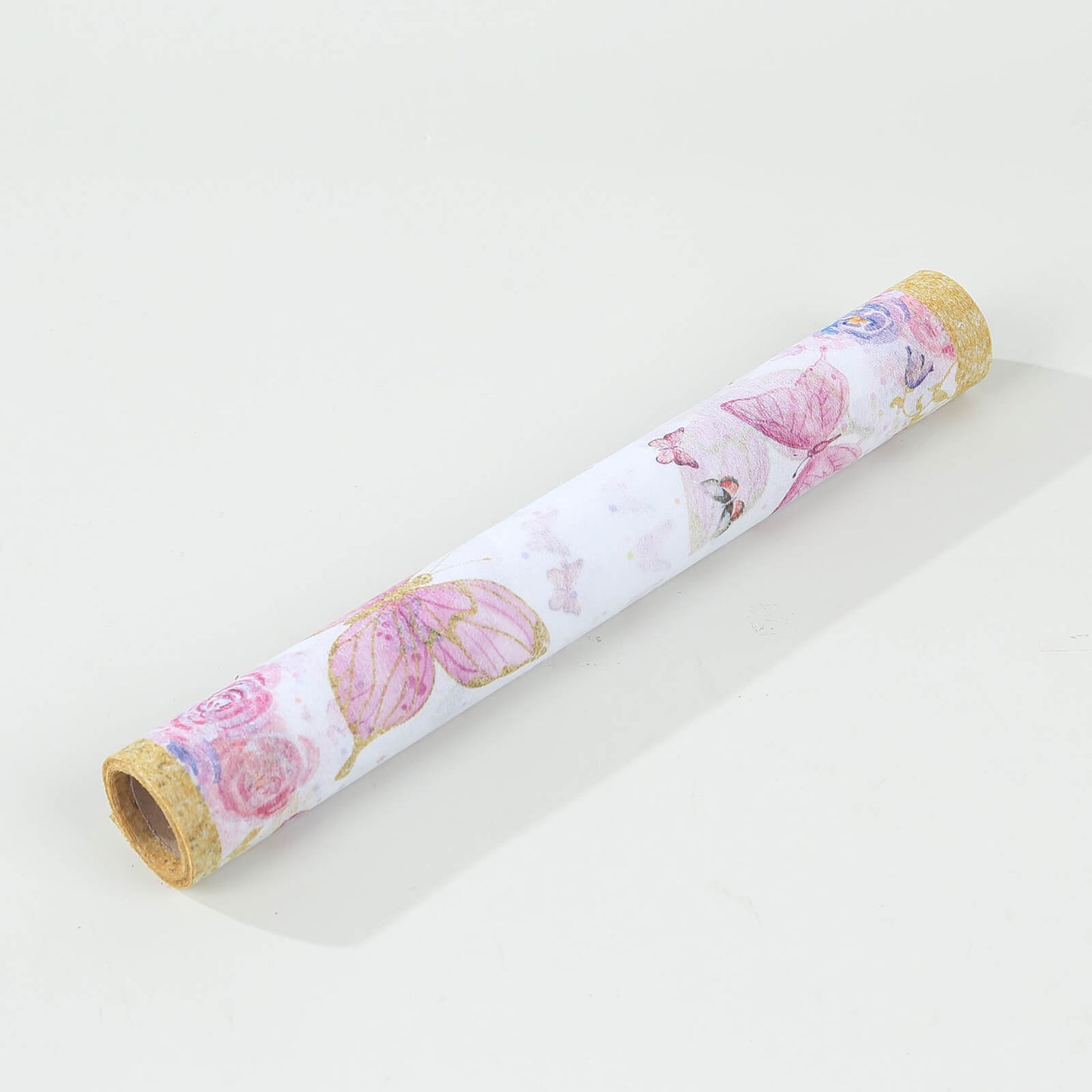 White table runner with pink butterflies for stylish spring dining decor.