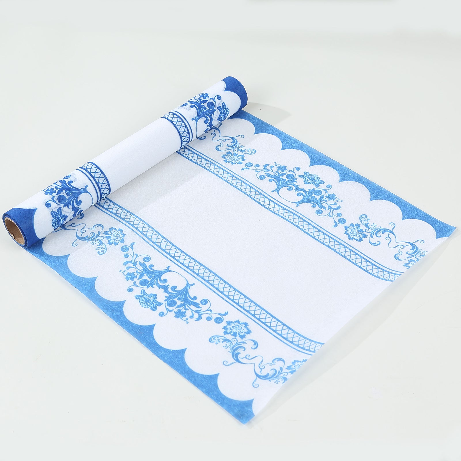 White and blue ornate floral disposable table runner.