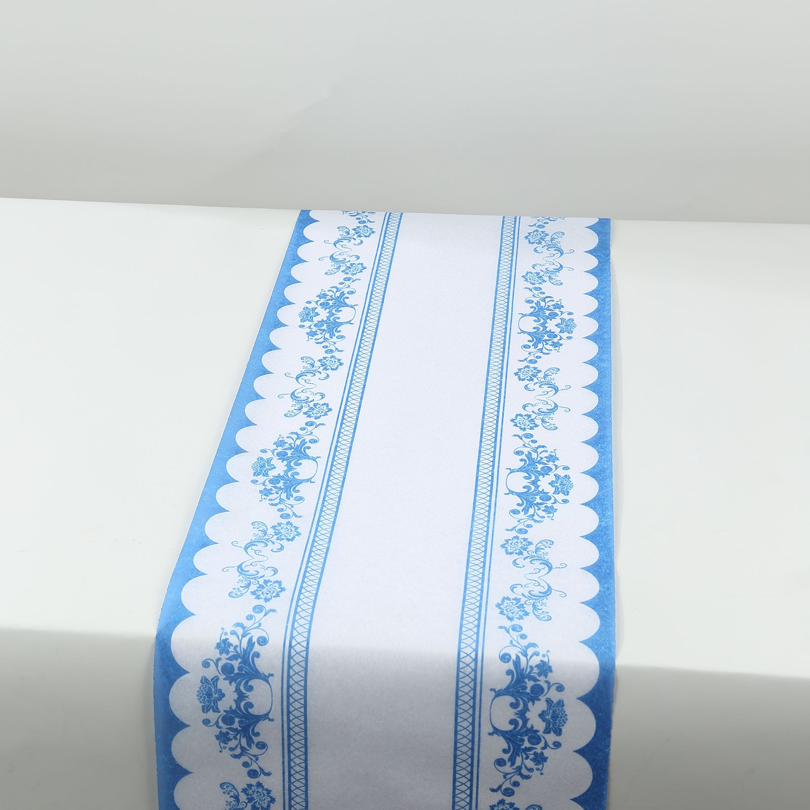 White table runner with blue ornate floral prints, stylish kitchen decor.