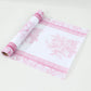 White disposable table runner with pink floral pattern, stylish kitchen decor.