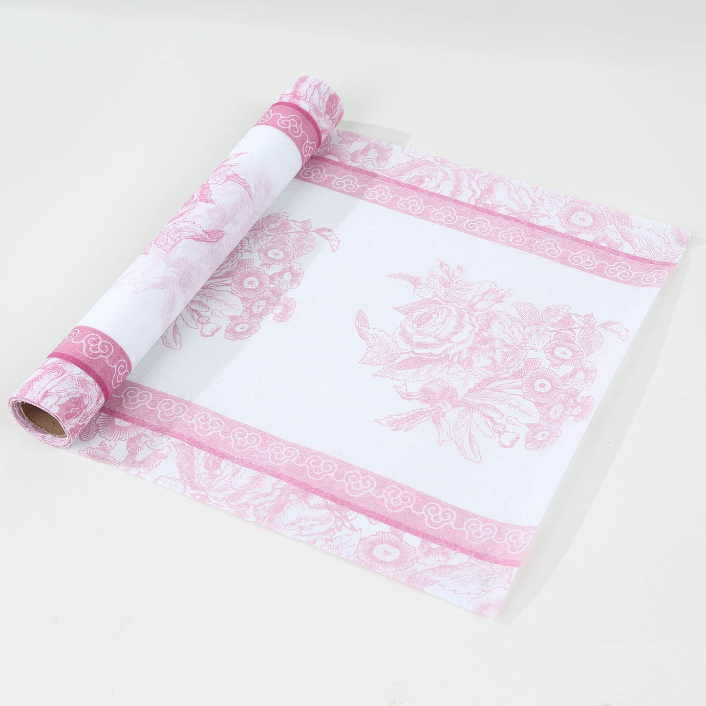 White disposable table runner with pink floral pattern, stylish kitchen decor.
