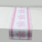 White and pink floral disposable table runner for stylish dining decor.