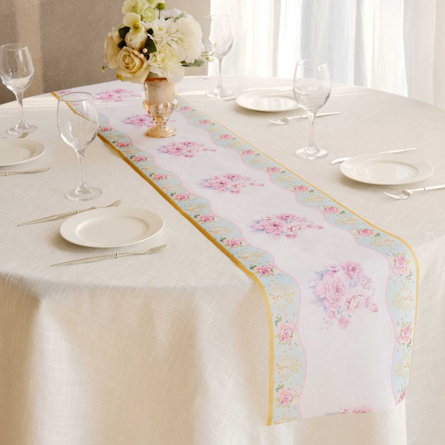 White with pink peony floral print disposable table runner on a dining table.