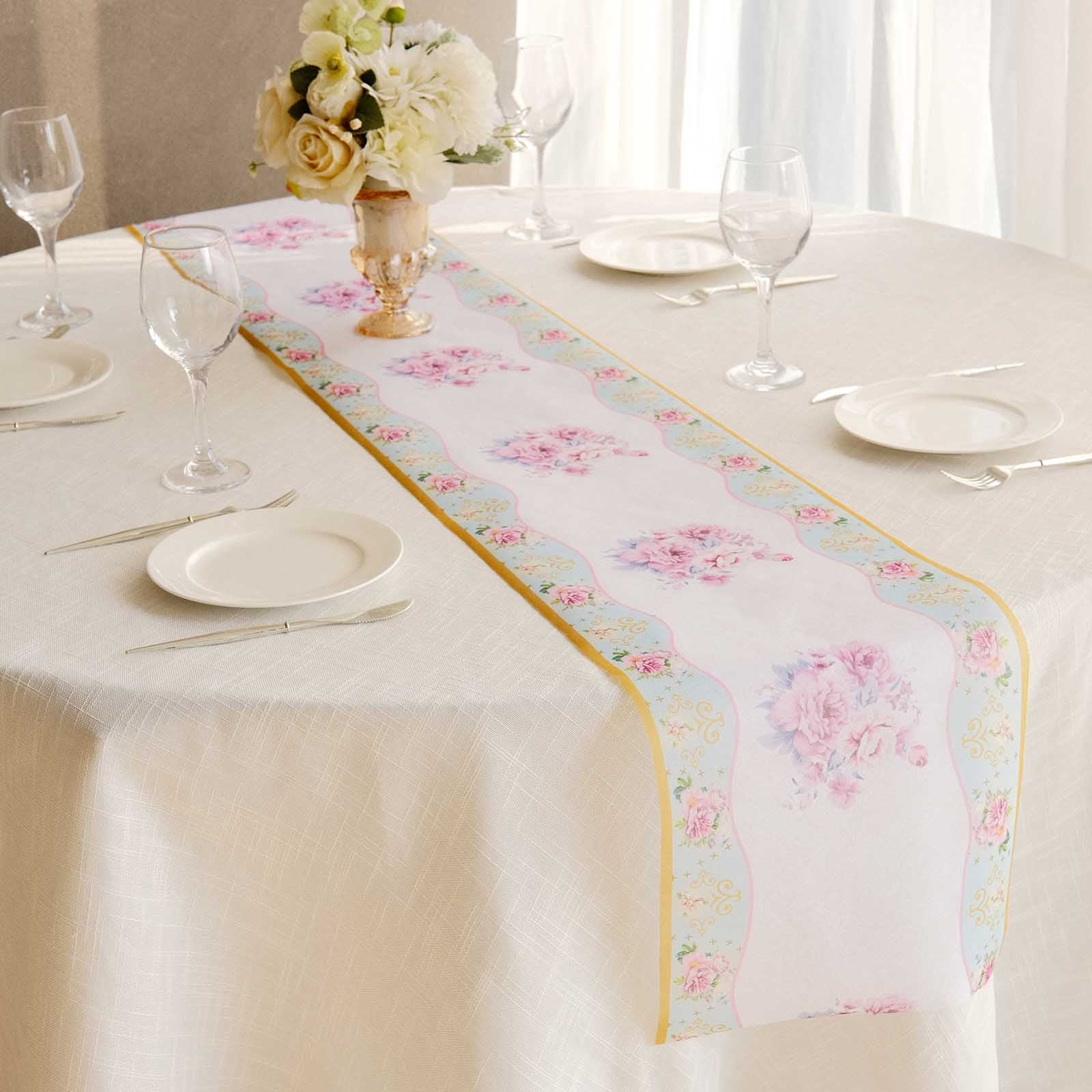 White with pink peony floral print disposable table runner on a dining table.