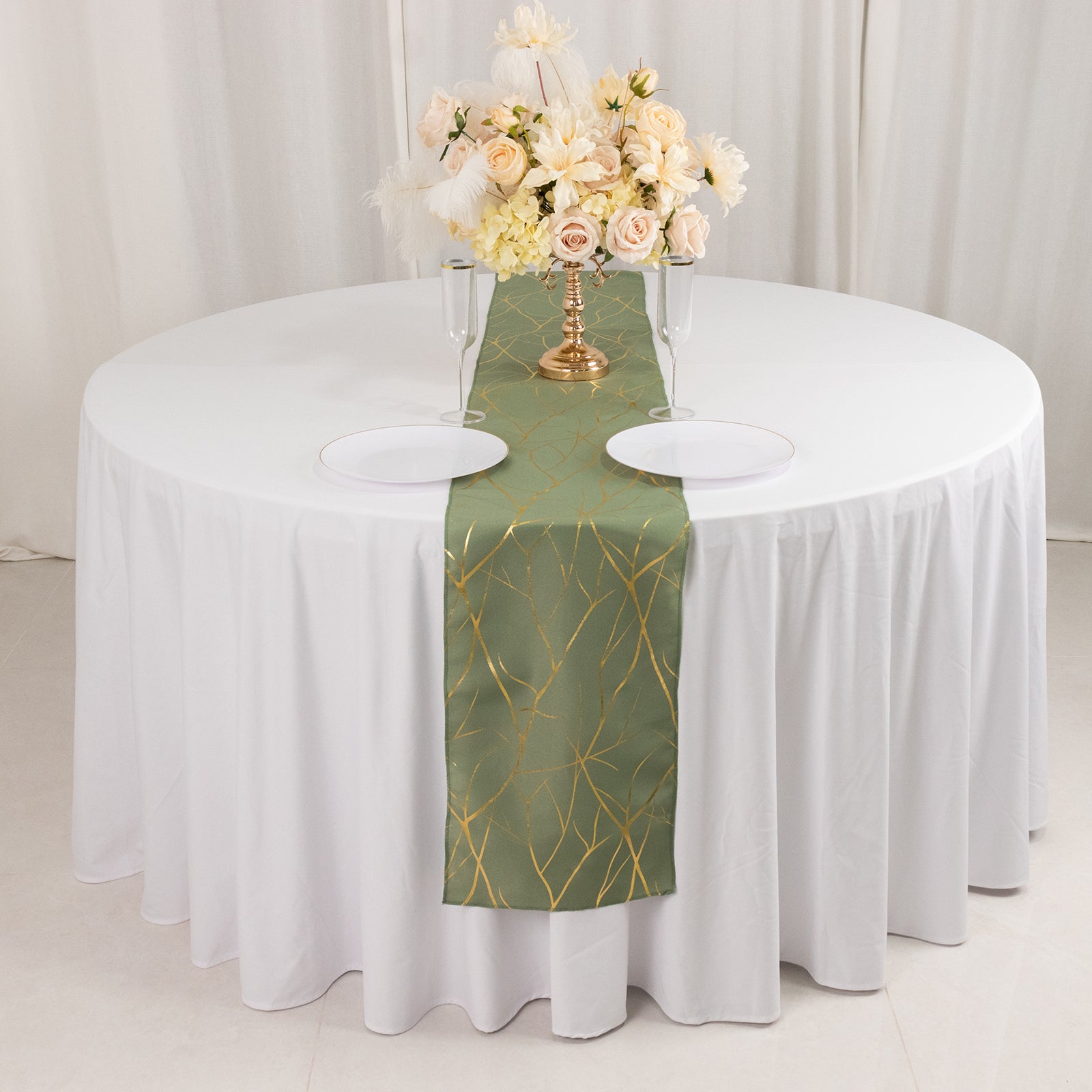 9ft Dusty Sage Green Table Runner with Gold Foil Tree Branch Pattern on a white table.