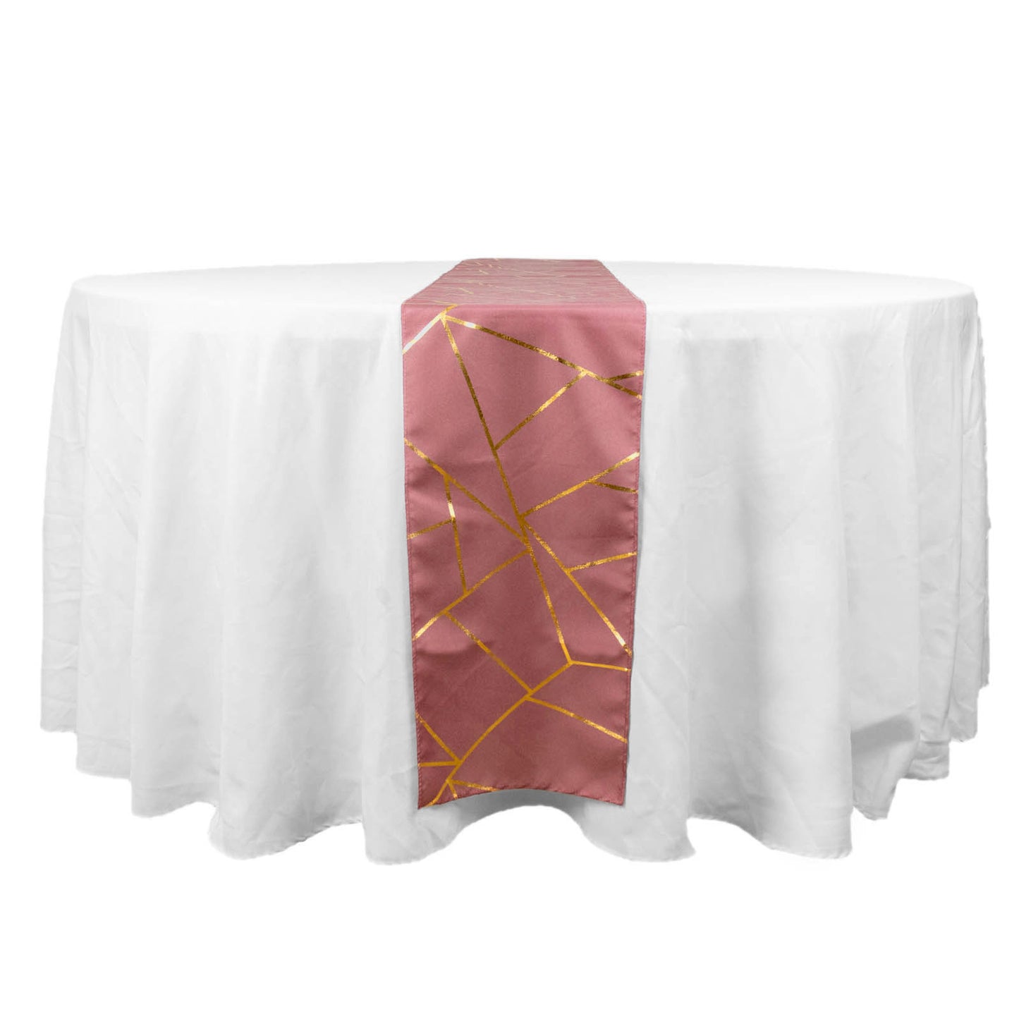 Cinnamon rose table runner with gold geometric pattern on a white table.