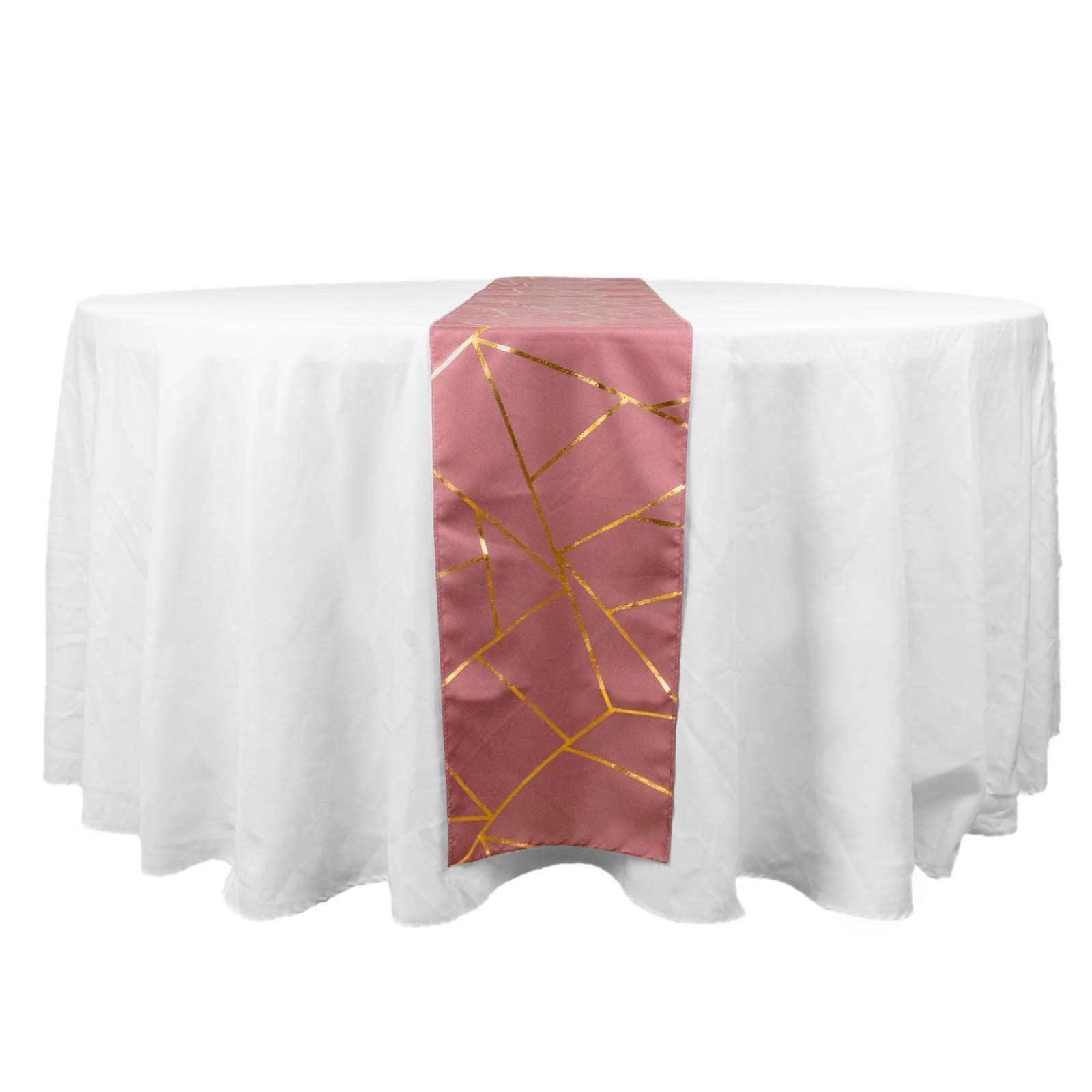Cinnamon rose table runner with gold geometric pattern on a white table.