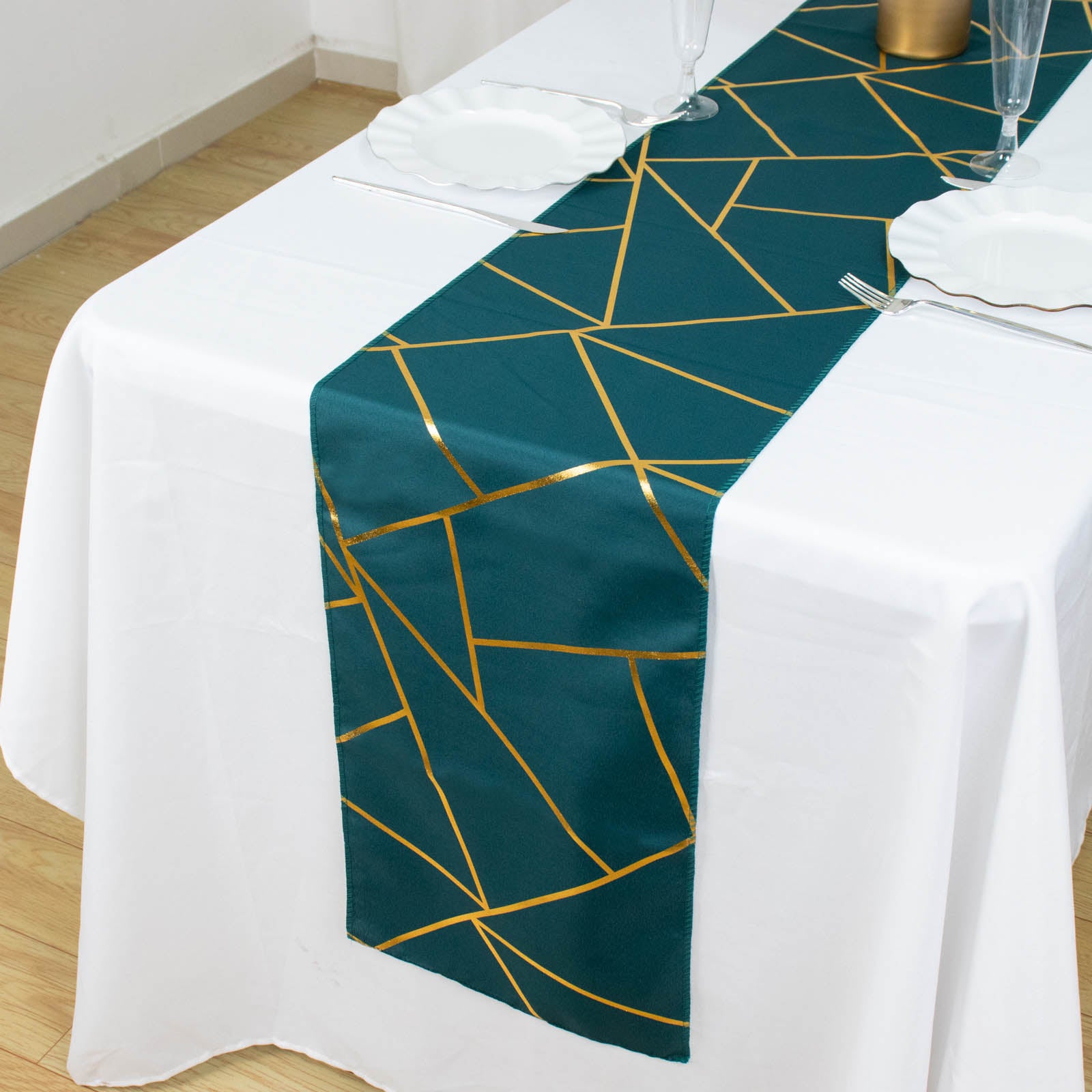 Peacock teal table runner with gold foil geometric pattern.