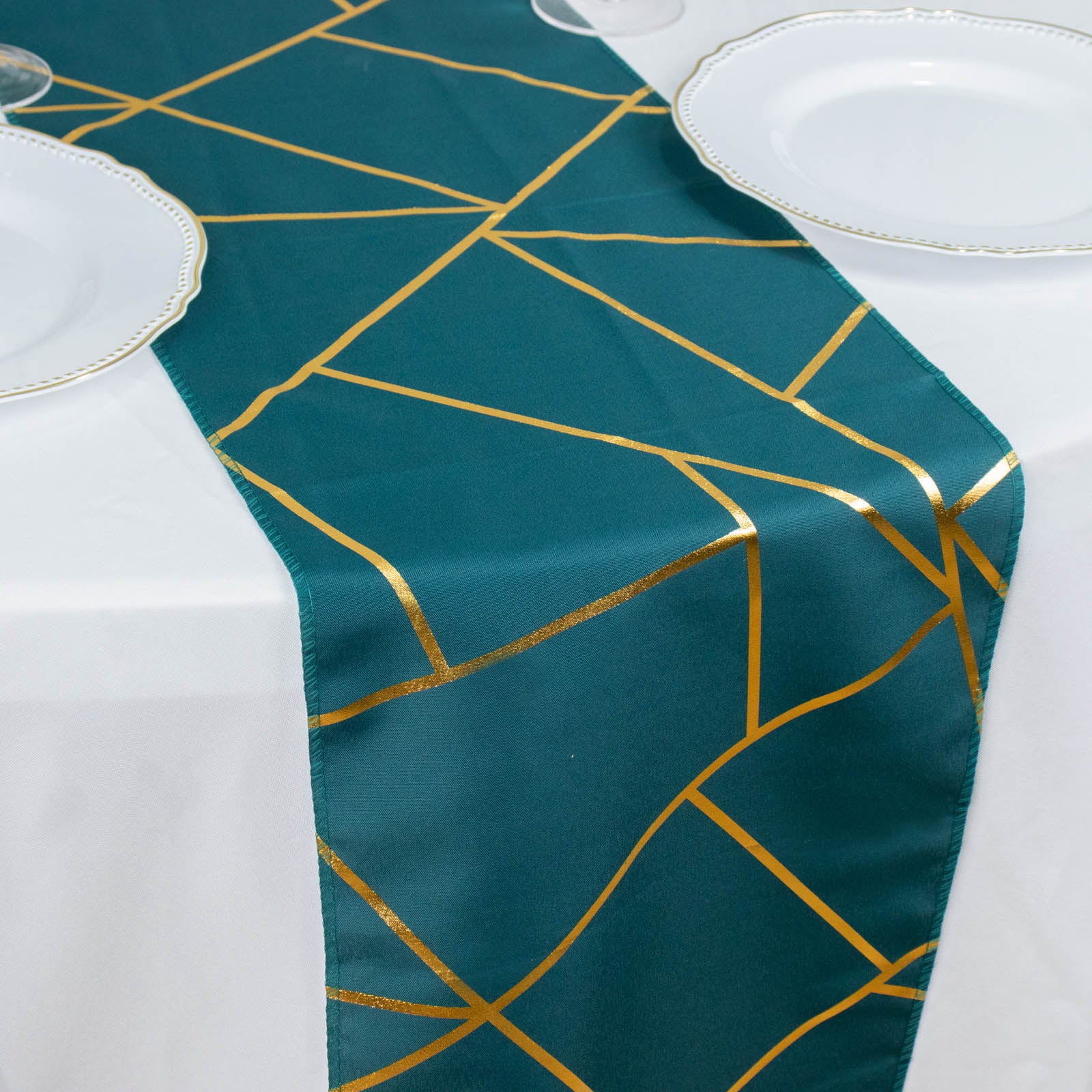 Peacock teal table runner with gold foil geometric pattern.