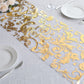Metallic gold sheer organza table runner with swirl foil flower design.