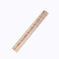 Metallic gold faux suede table runner roll for stylish event decoration.