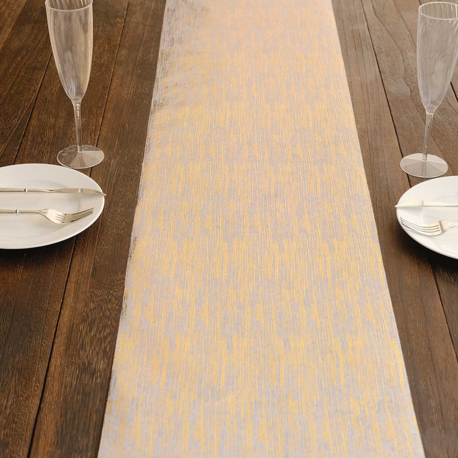 Metallic gold faux suede table runner on a wooden table setting.