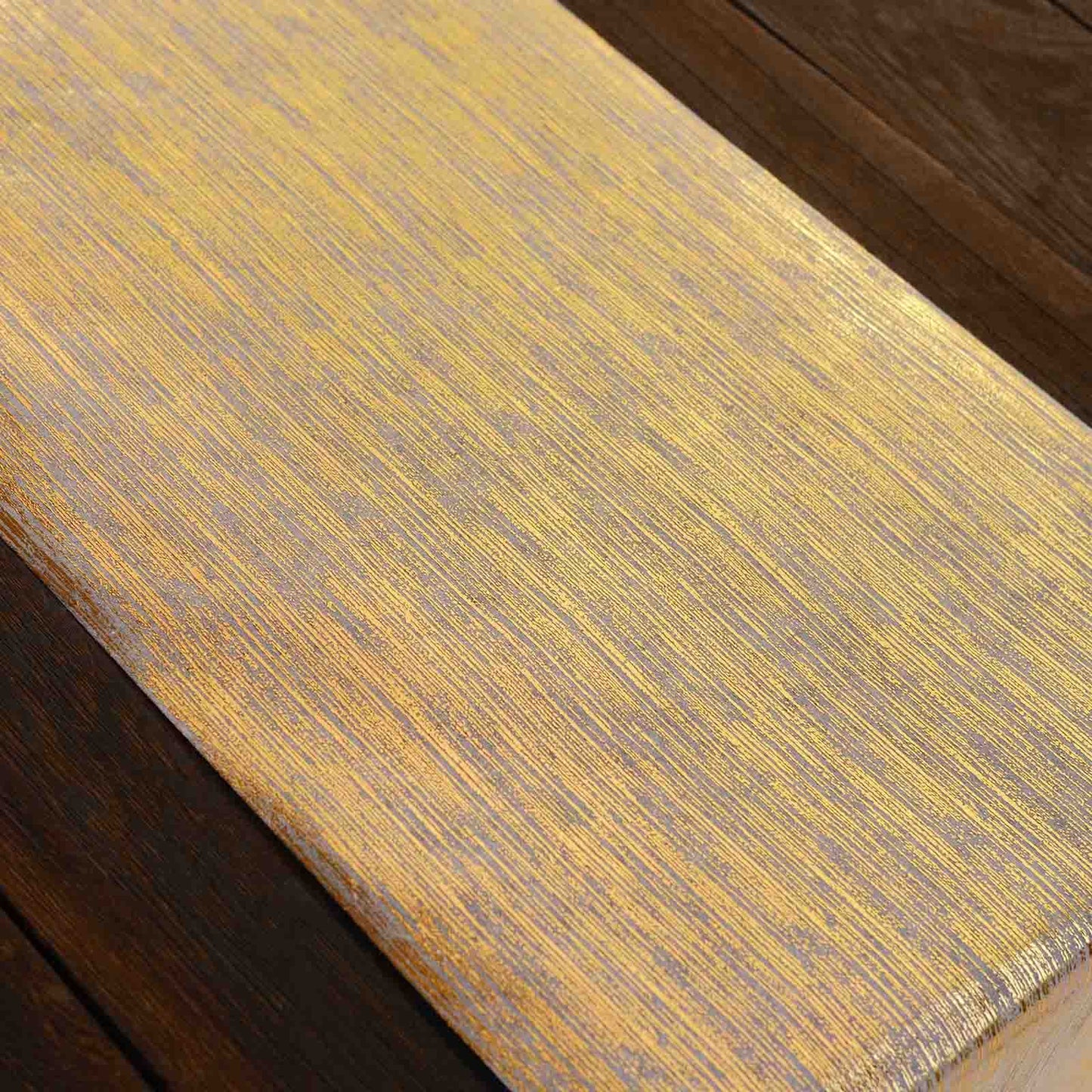 Metallic gold faux suede table runner roll for stylish event decoration.