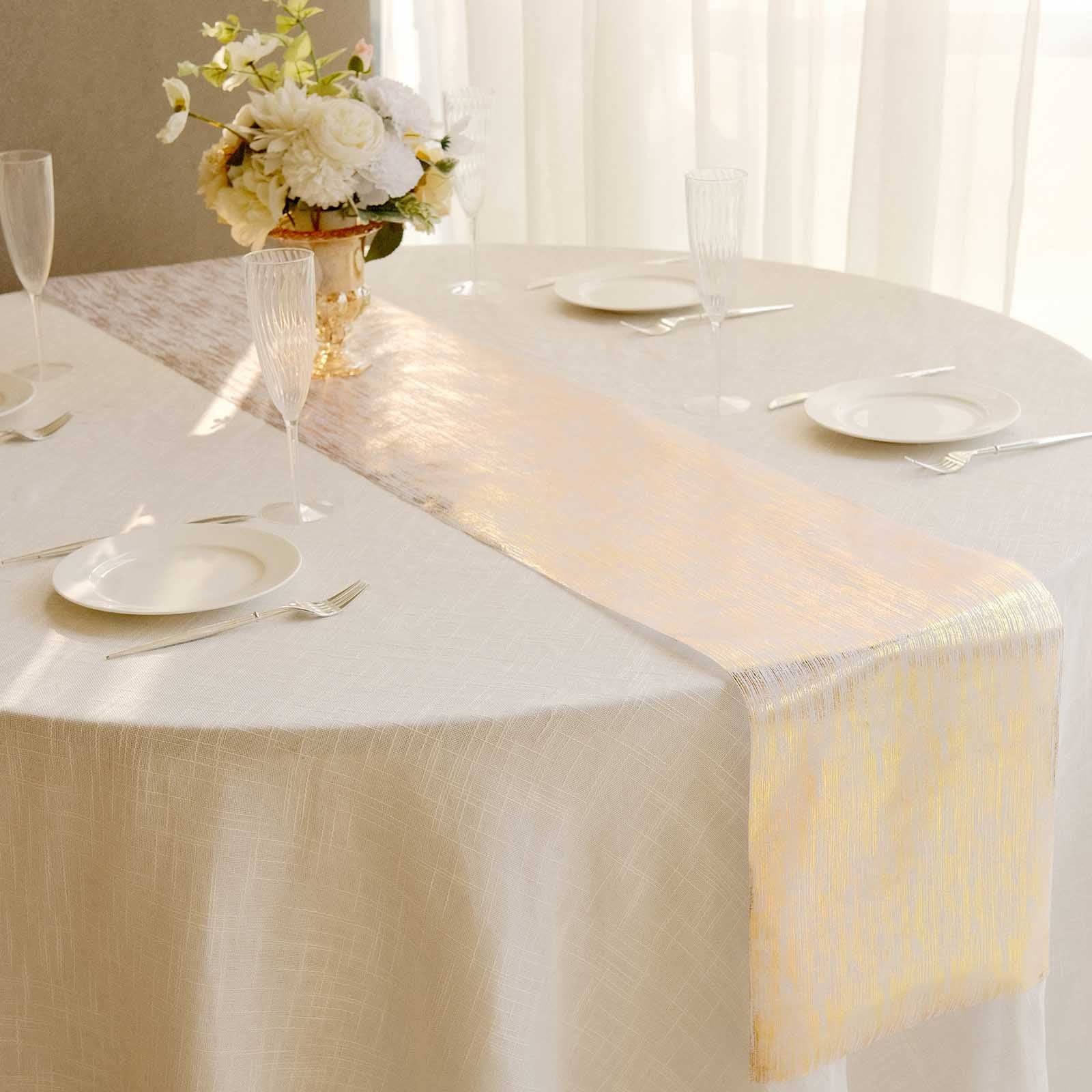 Metallic gold faux suede table runner on a cream tablecloth.