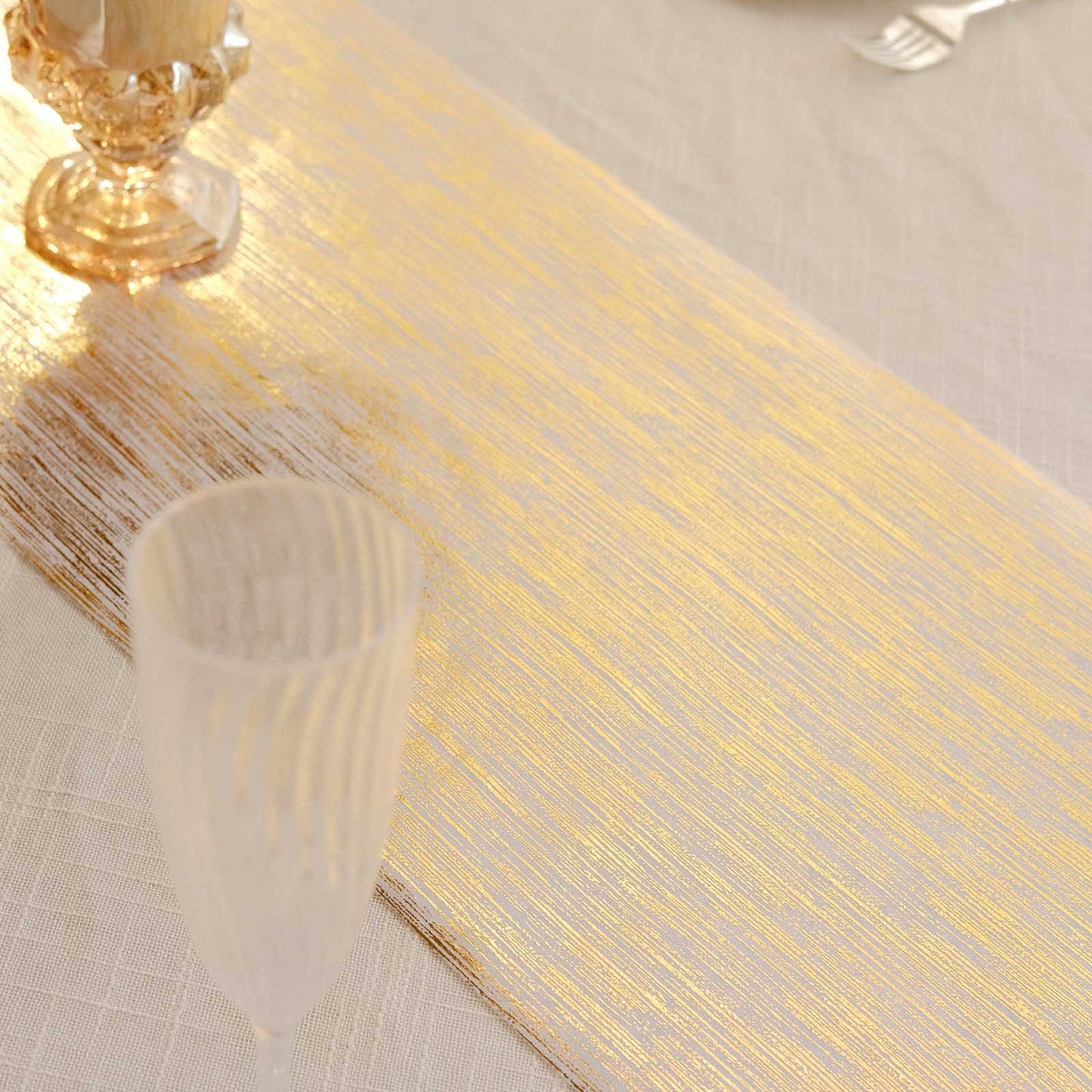 Metallic gold disposable table runner on a stylish event table setting.
