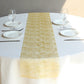Metallic gold glitter mesh polyester disposable table runner on a round table.