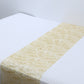Metallic gold glitter mesh disposable table runner on a white table.