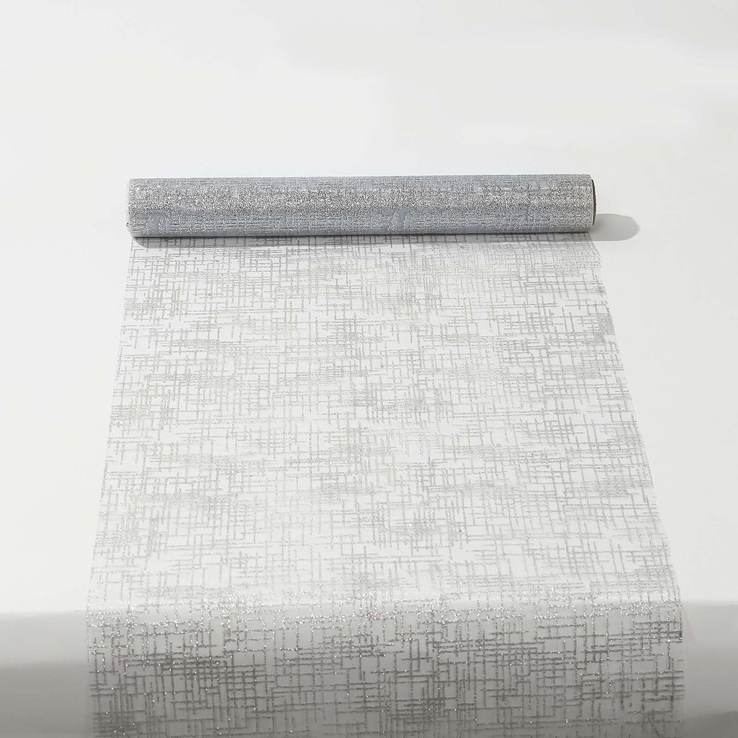 Metallic silver glitter mesh polyester disposable table runner on a white surface.