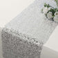 Metallic silver glitter table runner for event decoration.