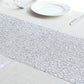 Metallic silver glitter table runner for event decoration.