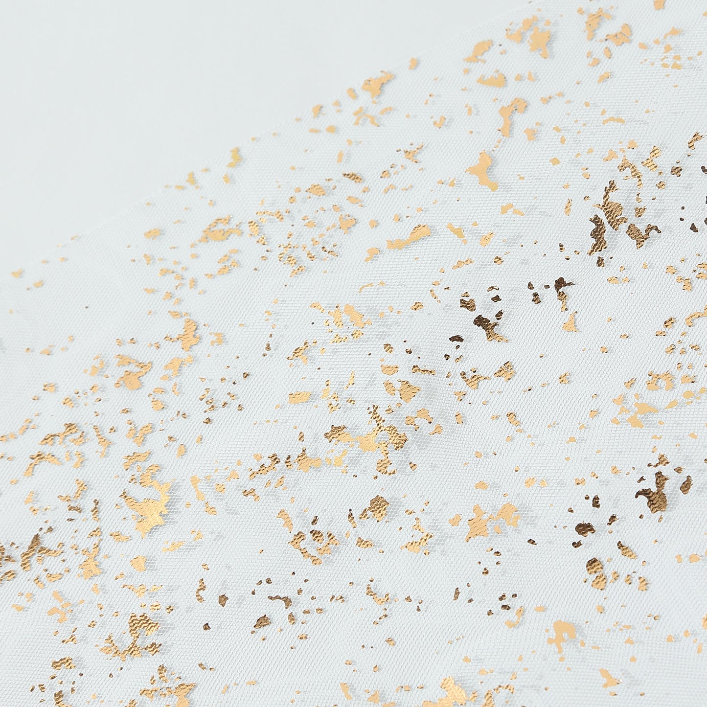 Metallic gold glitter sheer chiffon table runner with a boho style.