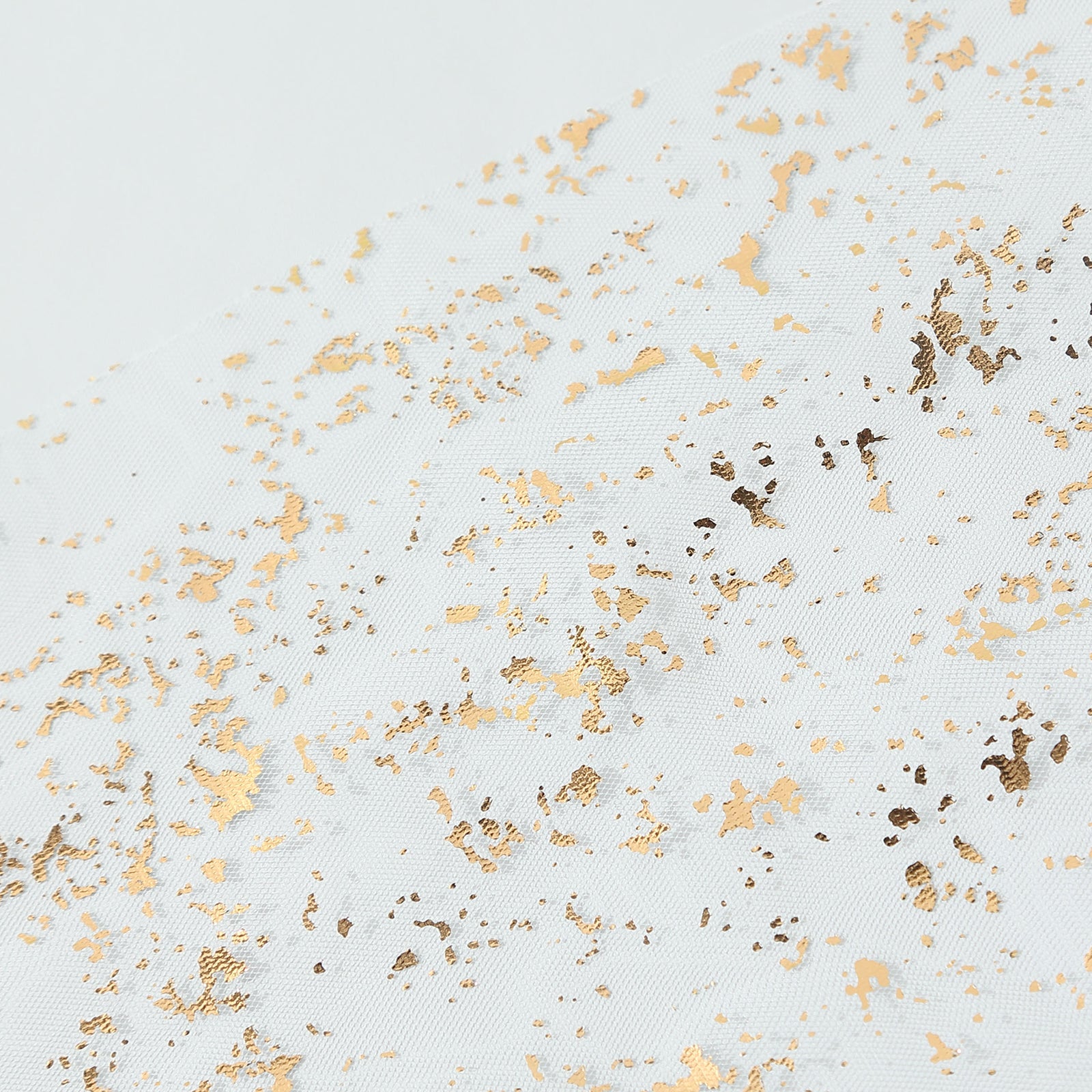 Metallic gold glitter sheer chiffon table runner with a boho style.