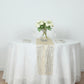Gold mesh organza table runner with water wave pattern on a white table.