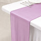 Fuchsia sheer organza table runner on a white table