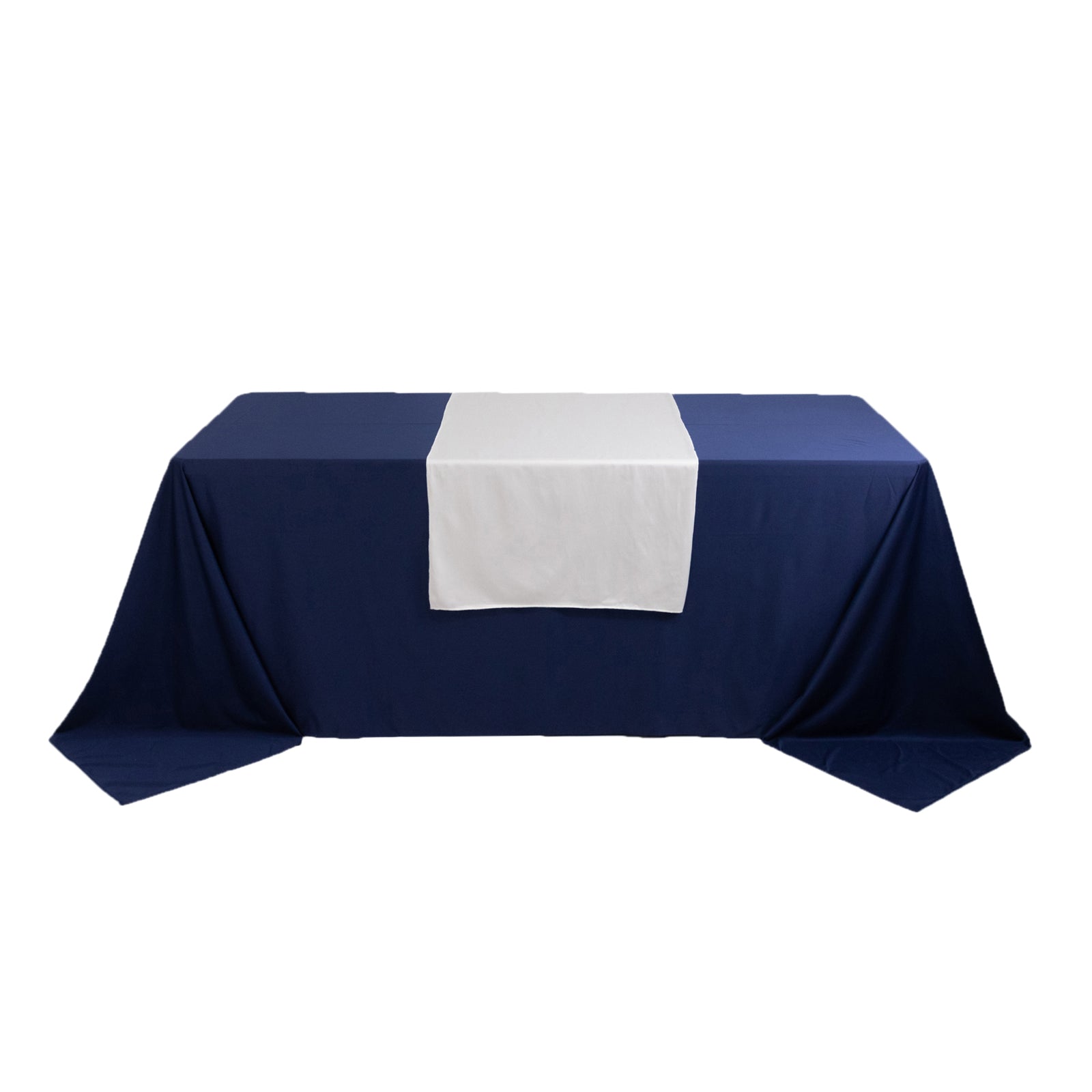 White polyester table runner on a navy blue table.