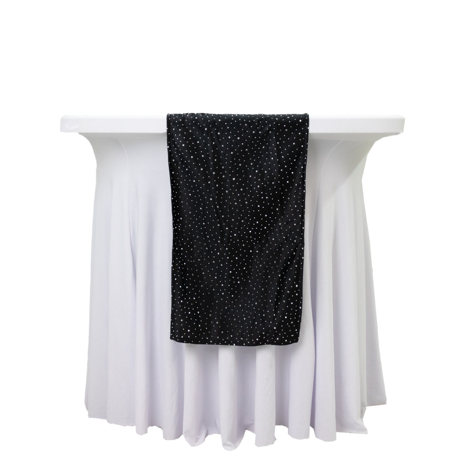 Black scuba table runner with rhinestone accents on a white table.