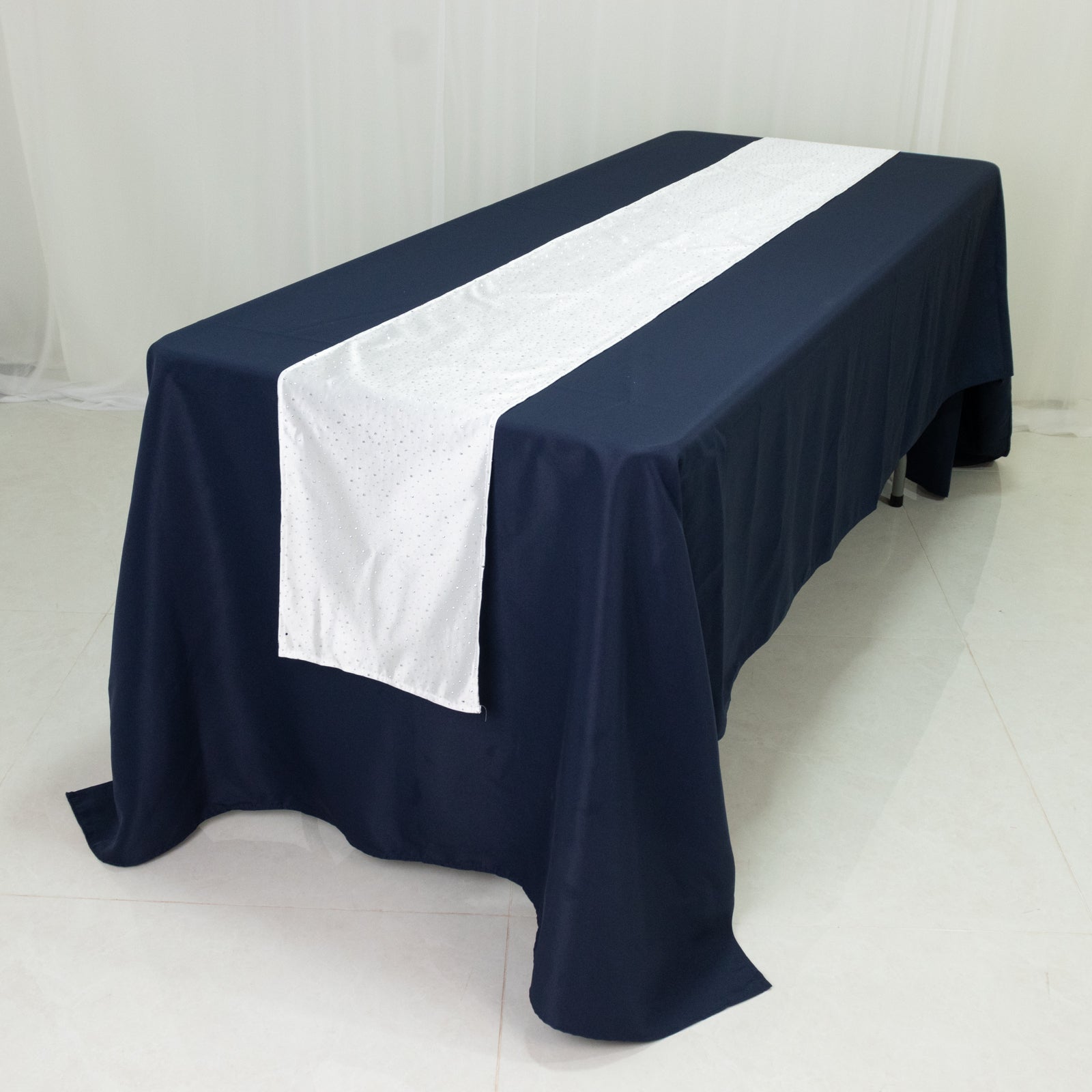 Navy table with a white rhinestone-accented scuba runner.