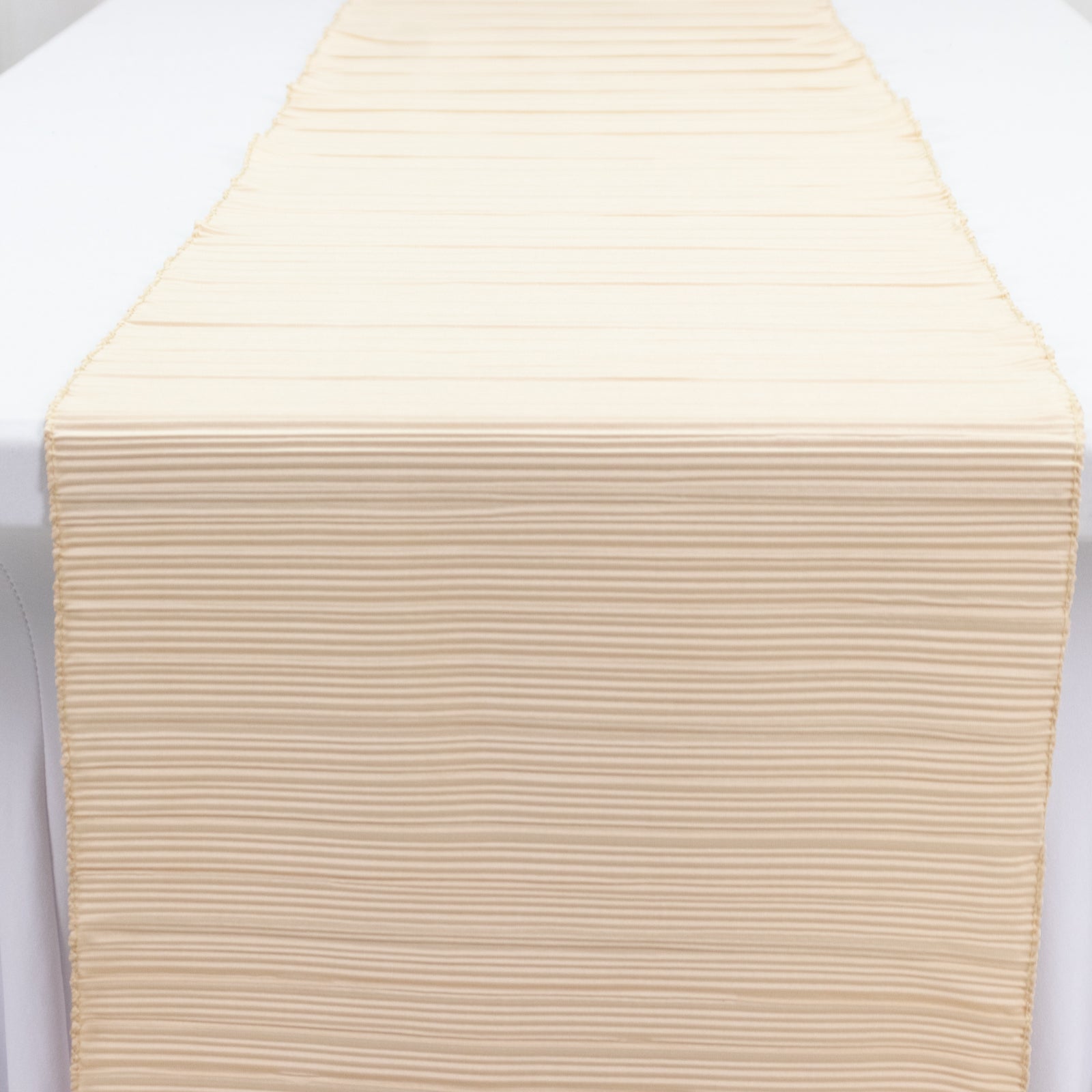 Beige accordion pleated scuba table runner, 12" x 108", wrinkle-free and stain-resistant.