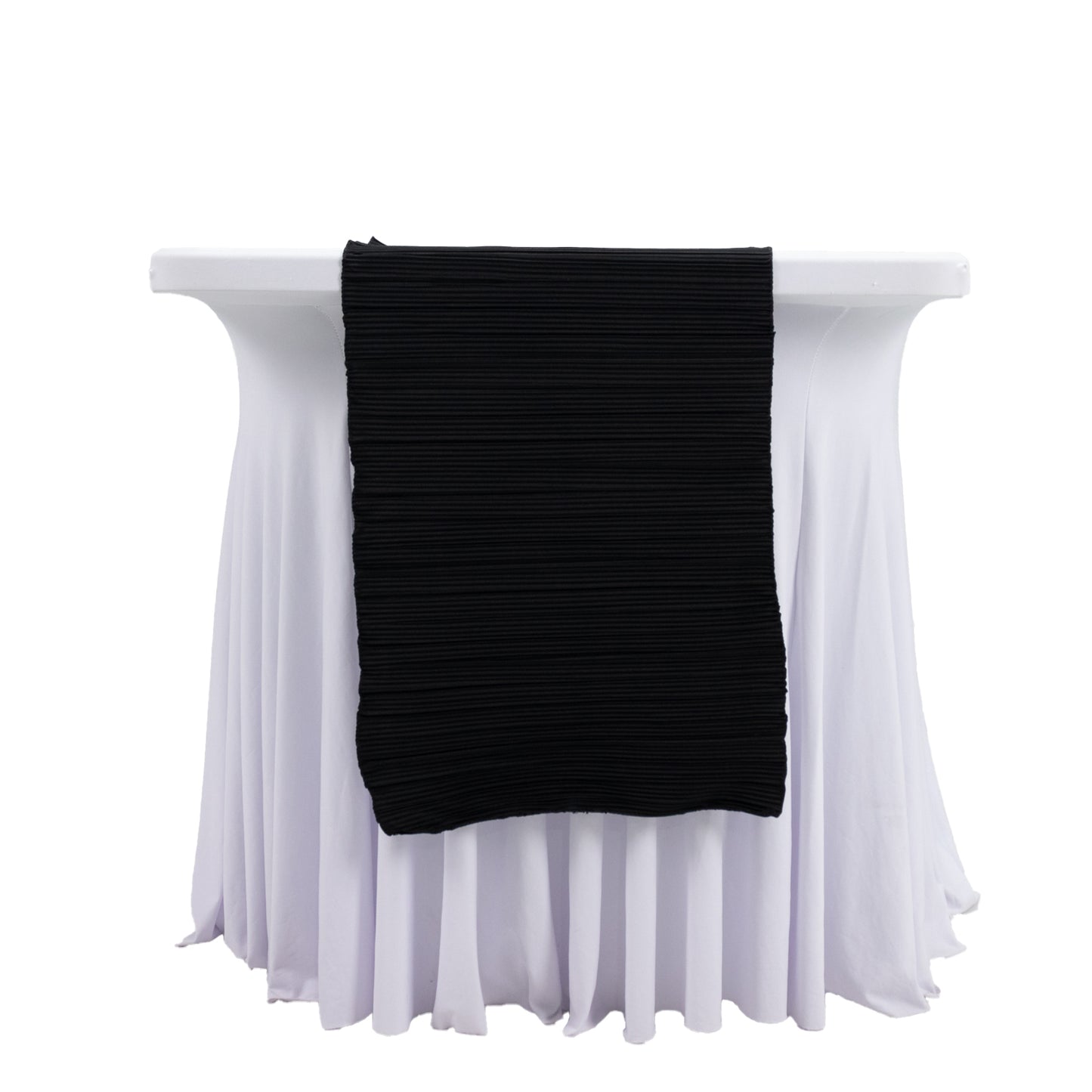 Black accordion pleated scuba table runner on a white table.