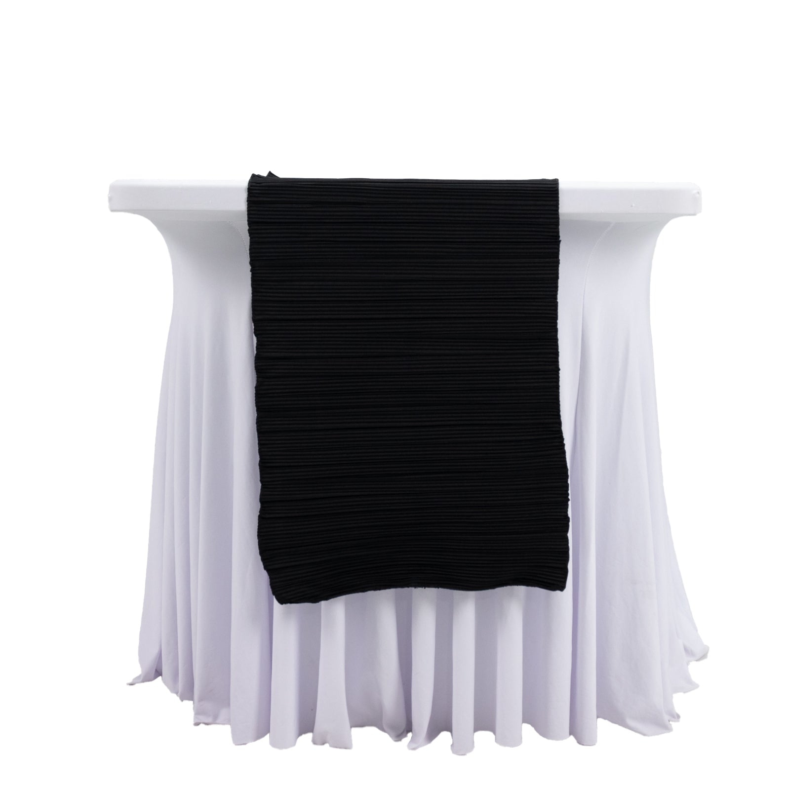 Black accordion pleated scuba table runner on a white table.