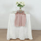 Rose gold sparkling glitter gauze table runner on a white table.