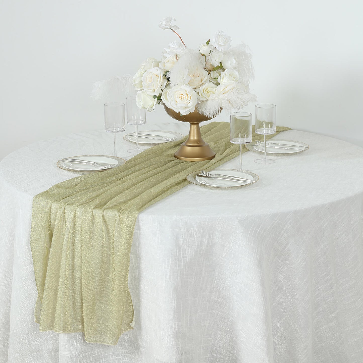 Champagne sparkling glitter gauze table runner on a round table.