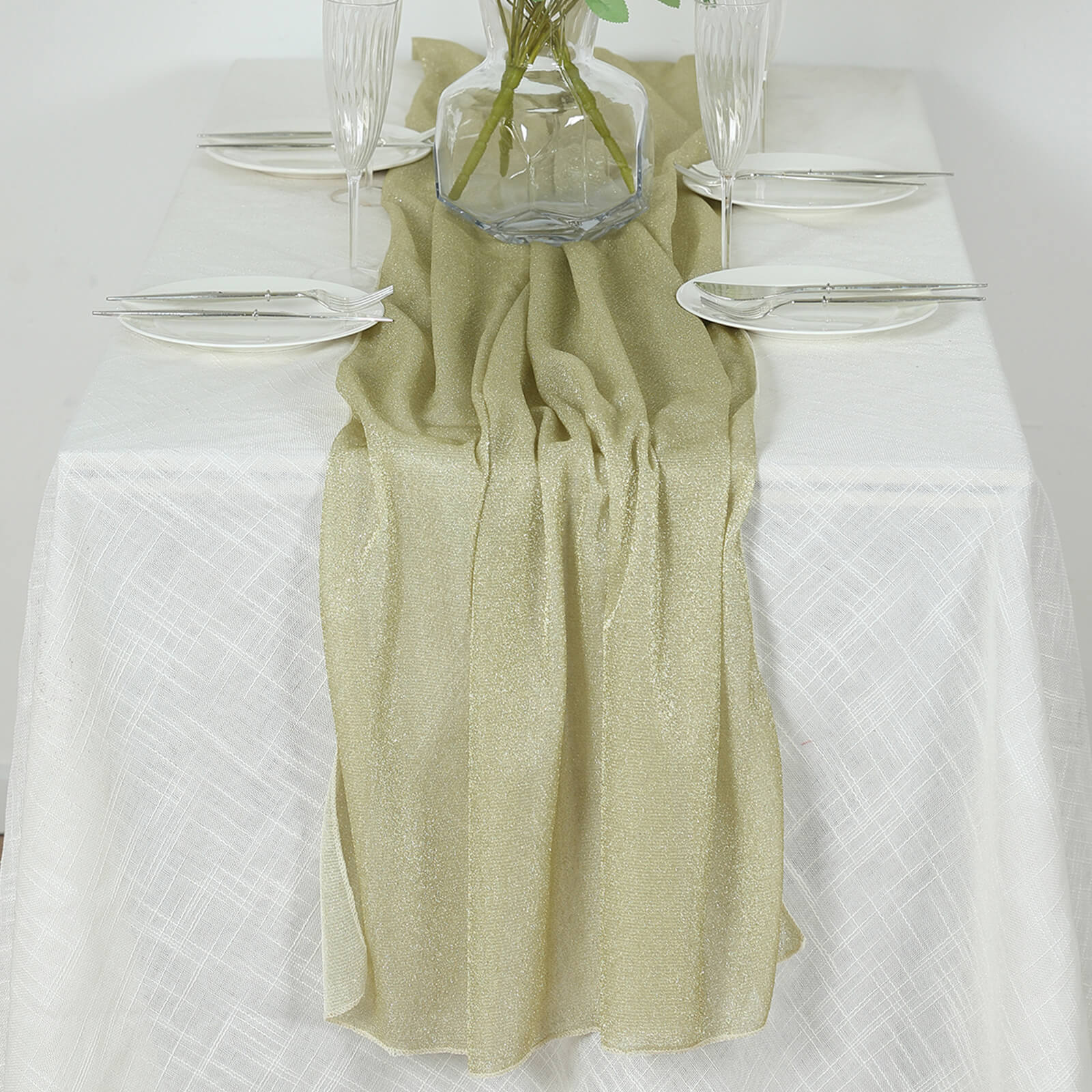 Champagne sparkling glitter gauze table runner on a white table.