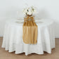 Gold sparkling glitter gauze table runner on a white table.