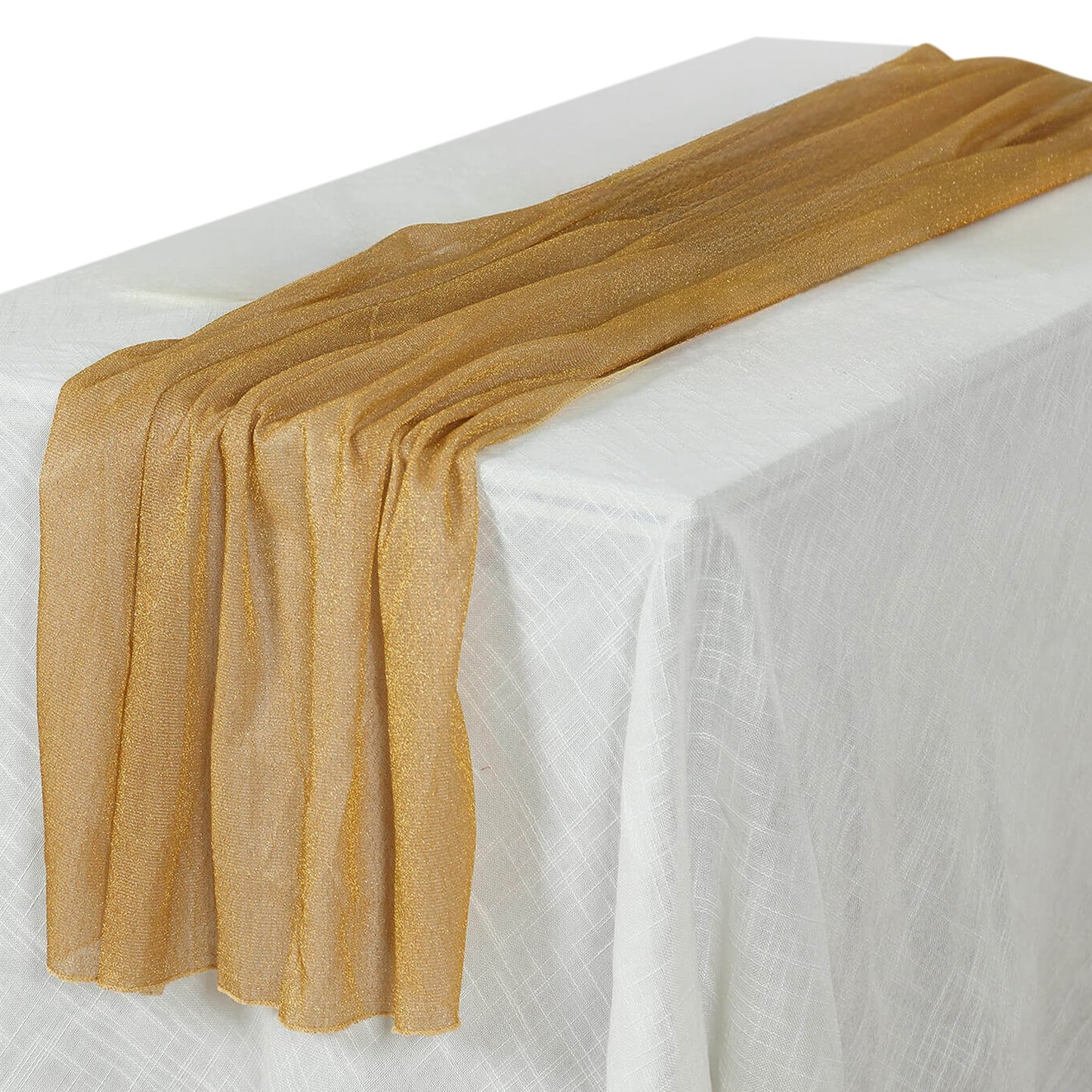 Gold sheer glitter table runner on a white tablecloth.