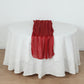 Red sparkling glitter gauze table runner on a white table.
