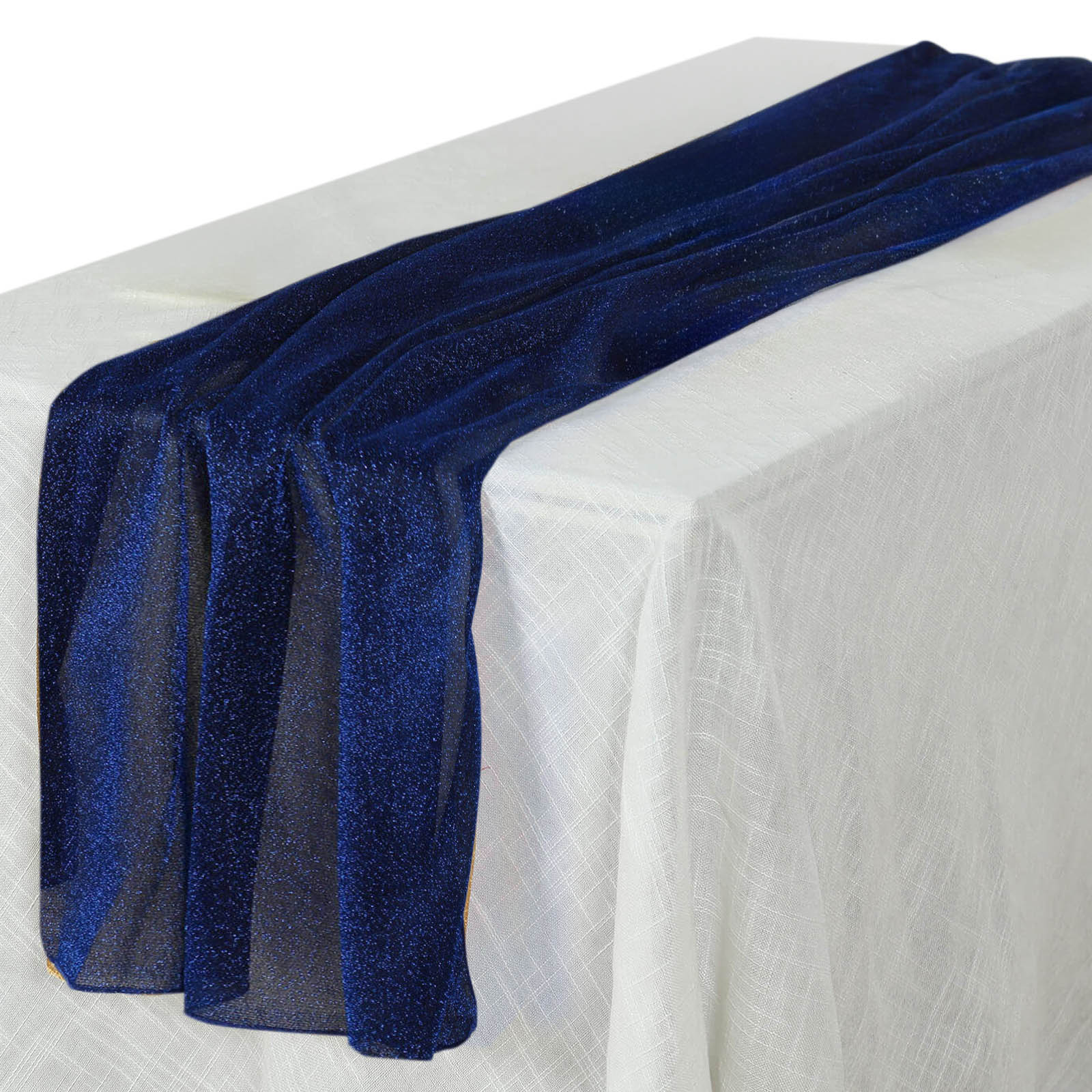 Royal blue sparkling glitter table runner on a white tablecloth.