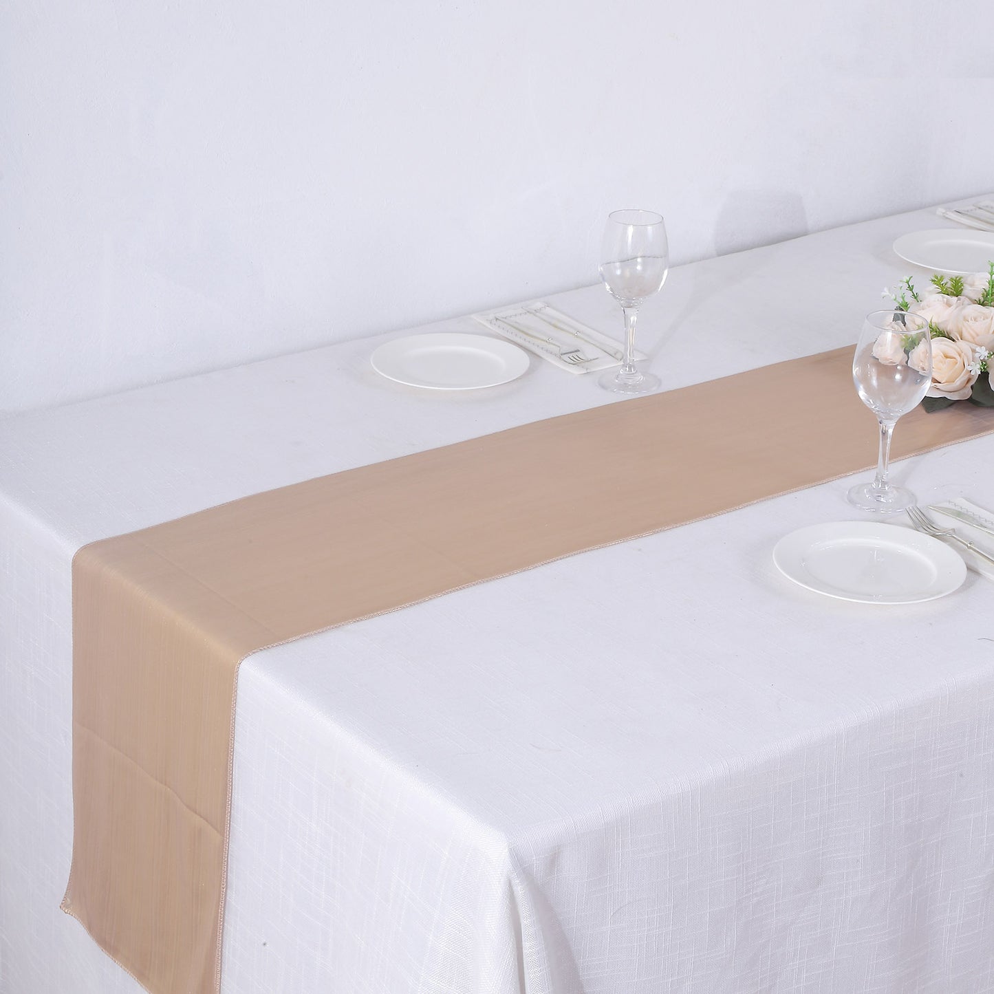 Blush shimmer sequin table runner on a white table setting.