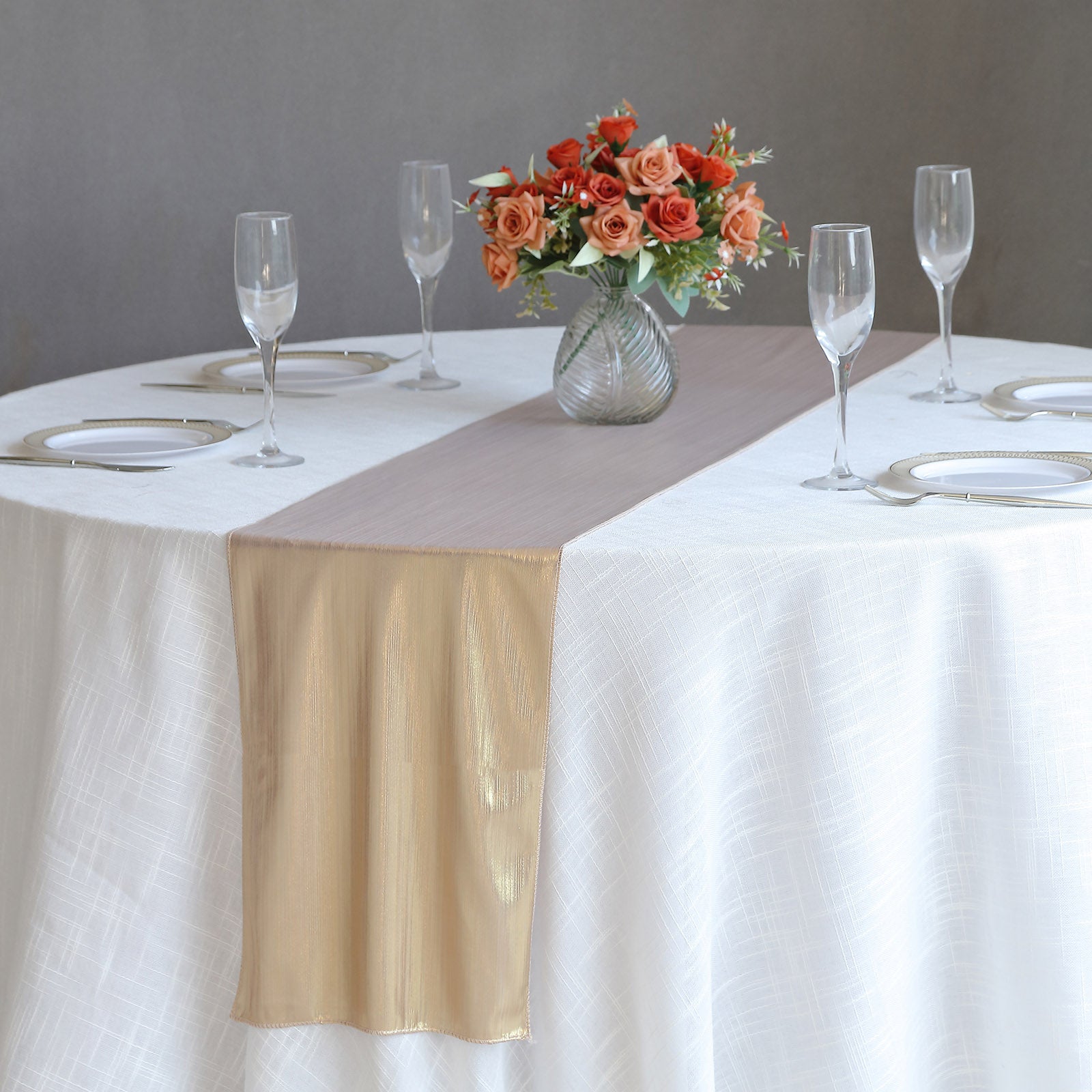 Blush shimmer sequin table runner on a decorated dining table.